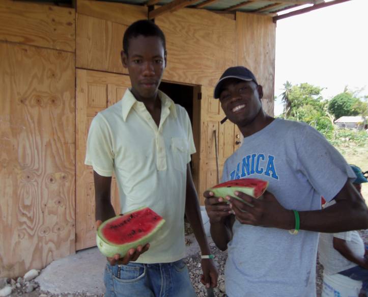 Youth interns at the training center in Haiti enjoying some watermelon.