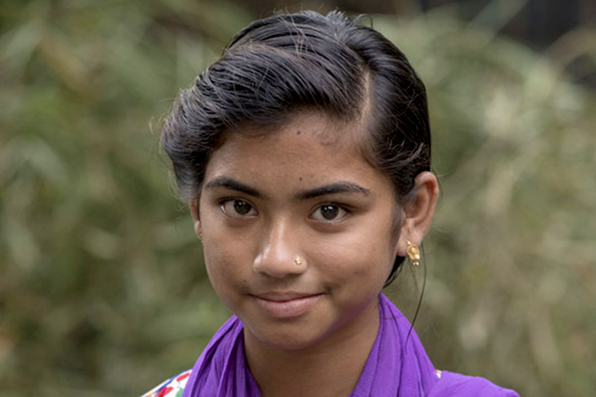 a girl receives an education in Bangladesh