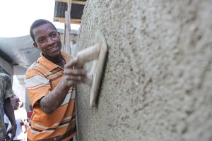 A young Haitian man uses his construction skills to rebuild homes in Haiti. 