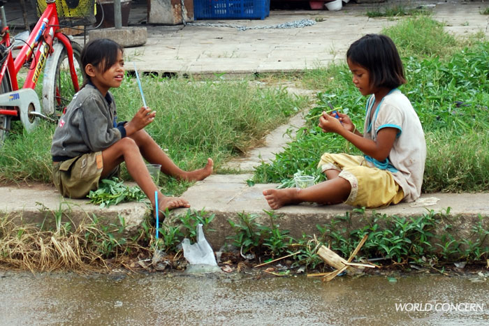 Girls play with each other along the Cambodia/Thailand border, an area popular among those who traffick children.