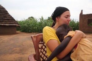 Jenny Simmons holds a child in South Sudan.