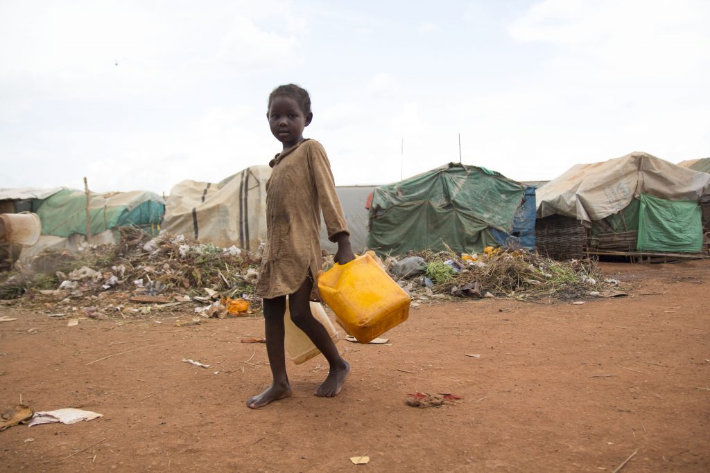 A girl collects water in an IDP camp in South Sudan.