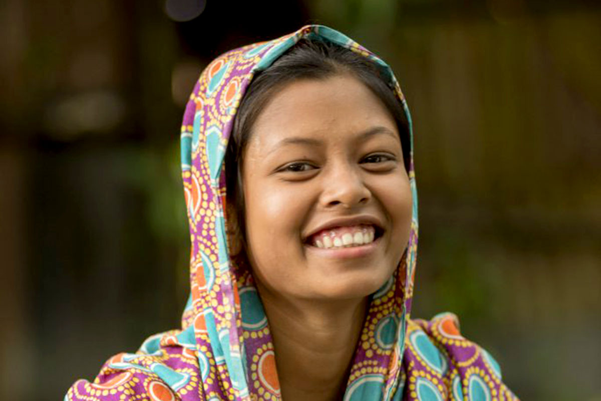 a girl receives education in Bangladesh