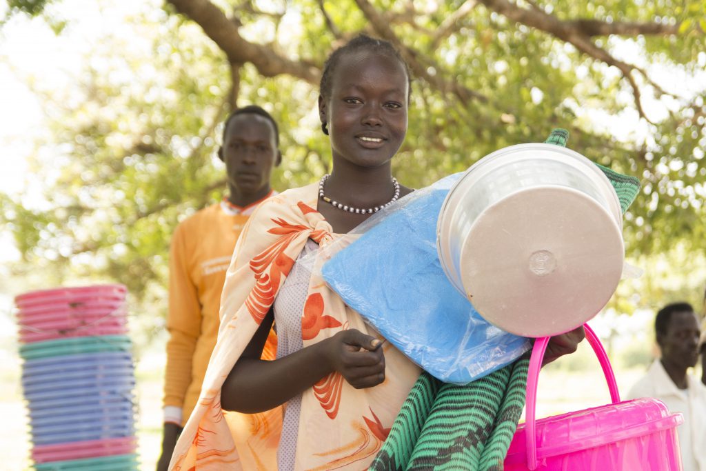A mom in South Sudan receives emergency shelter supplies