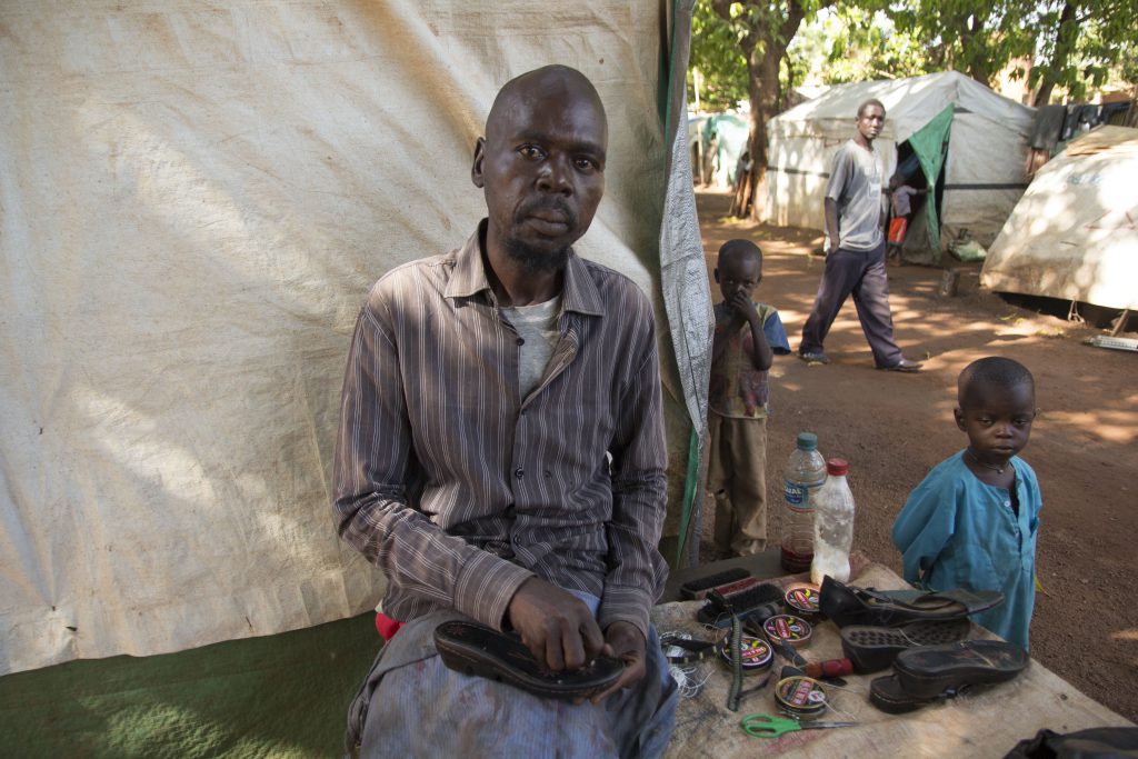 a man works in an internally displaced persons camp in South Sudan