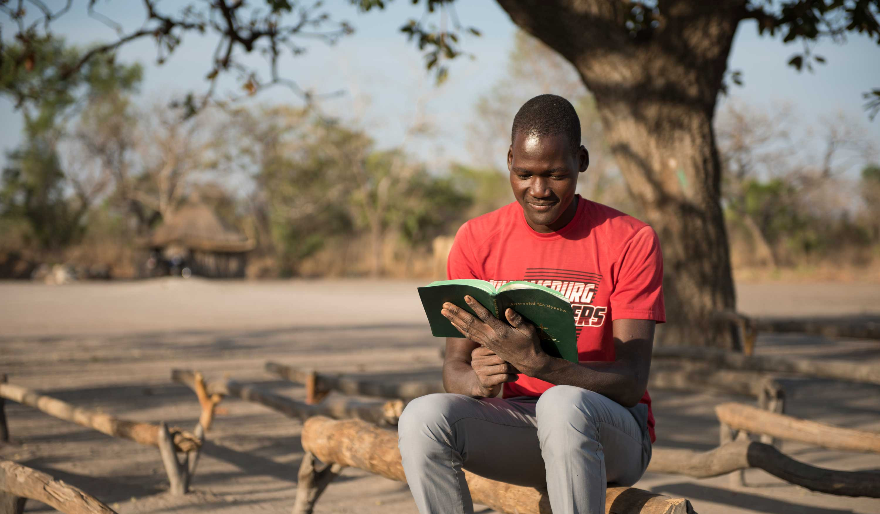 A South Sudanese evangelist reads his bible.