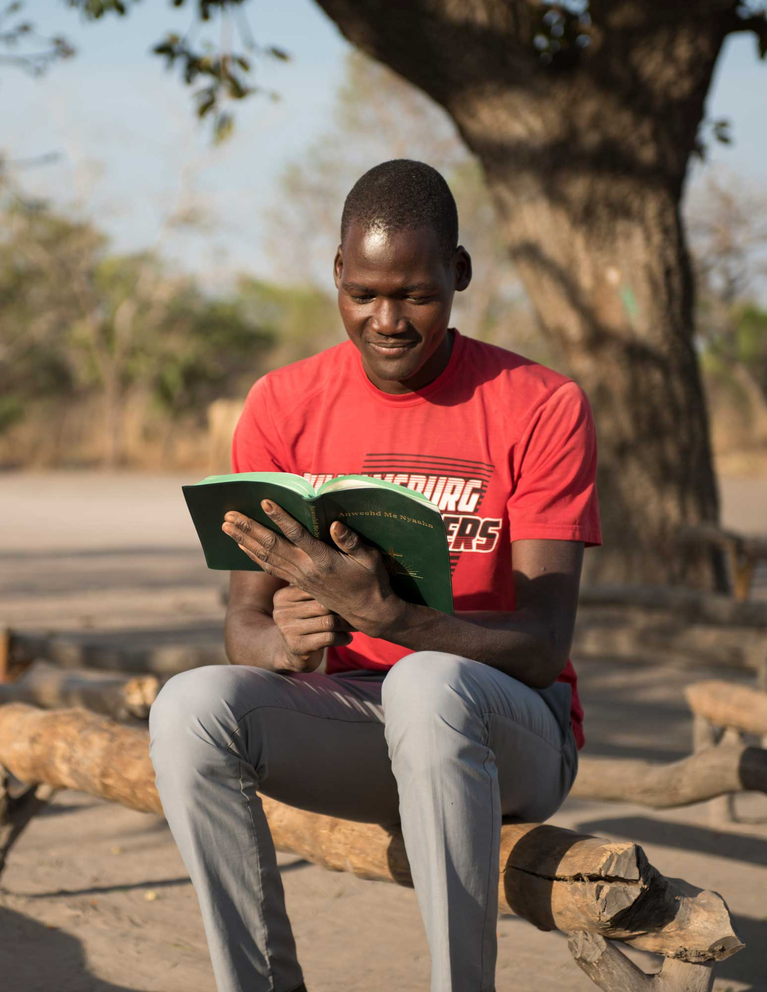 A South Sudanese evangelist reads his bible.