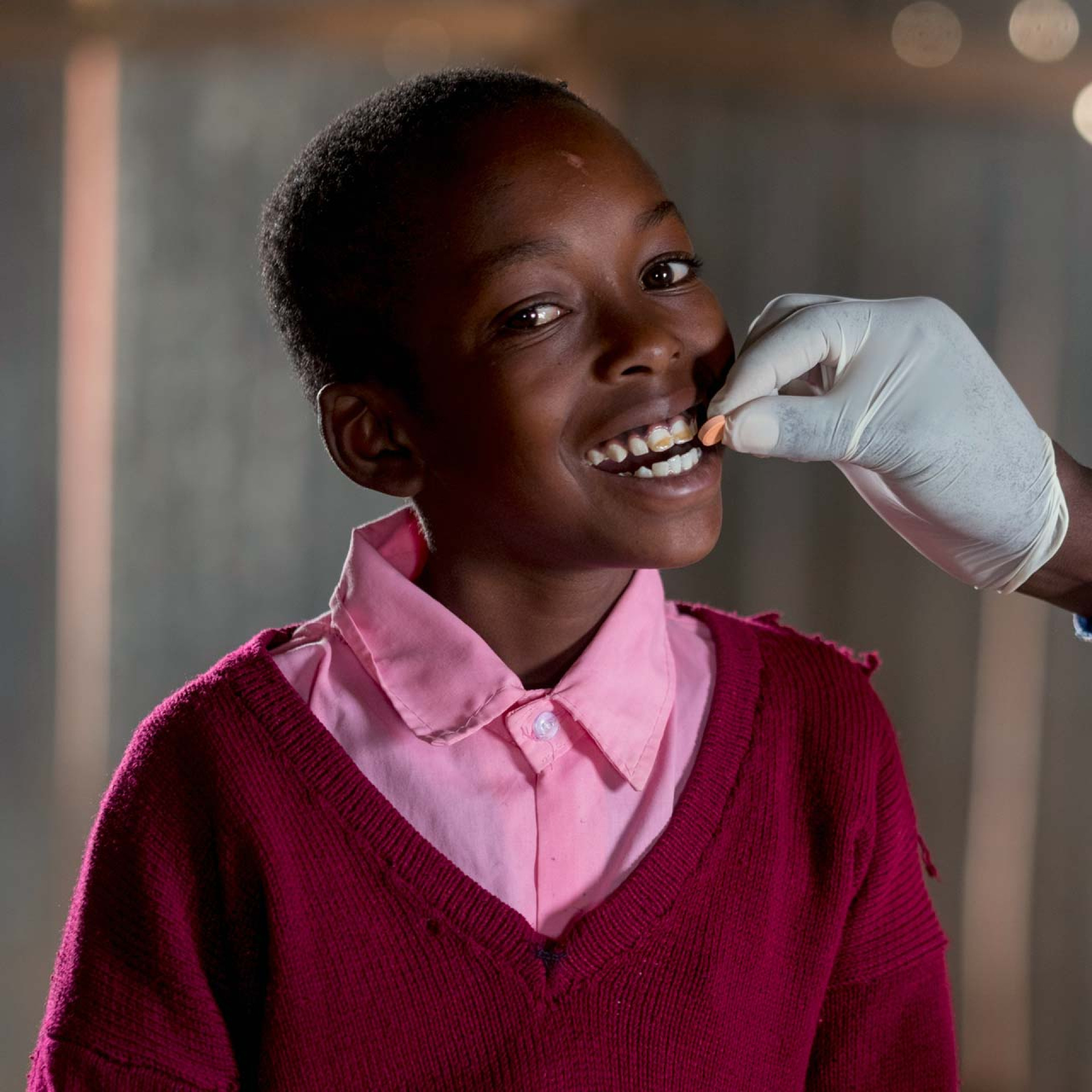 A child receives deworming medicine.