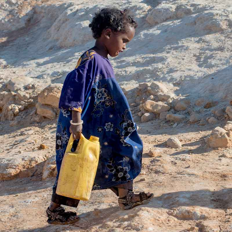 Child carrying water