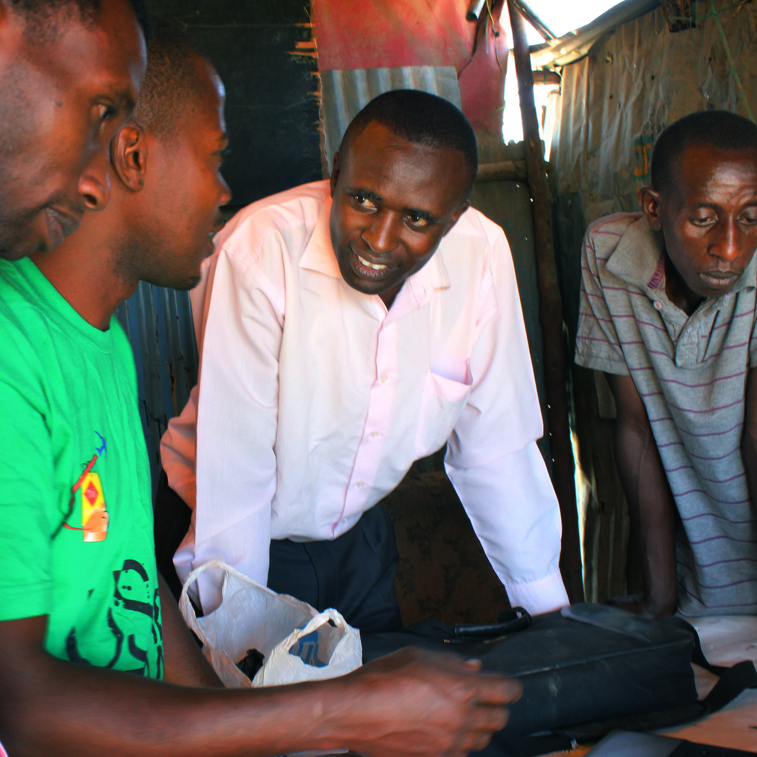 International staff in Kenya chatting about a project.