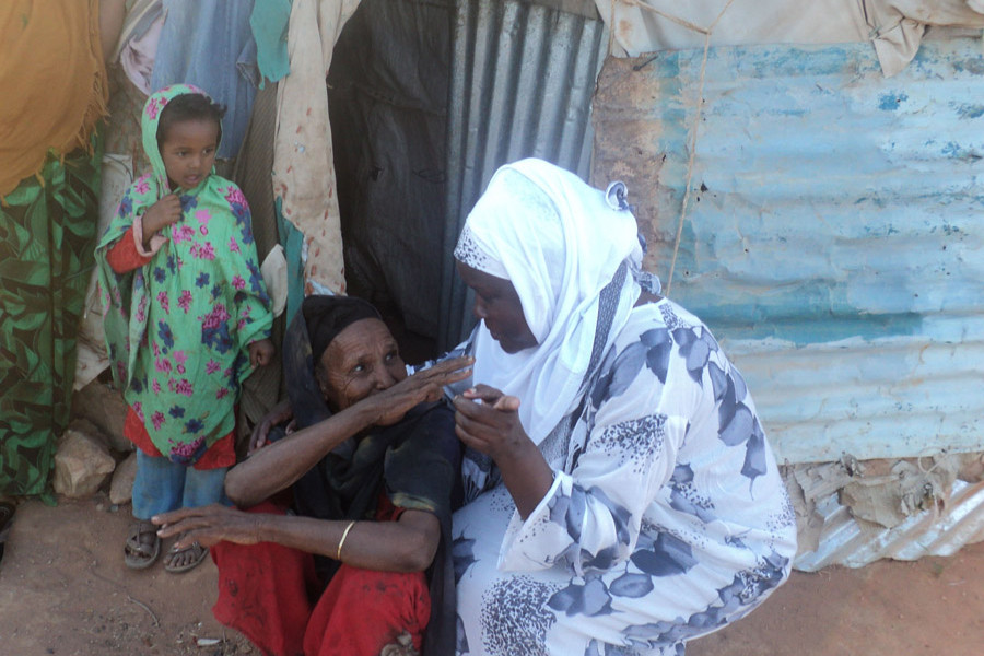 A World Concern staff member listens to the needs of an elderly muslim widow in Somalia.