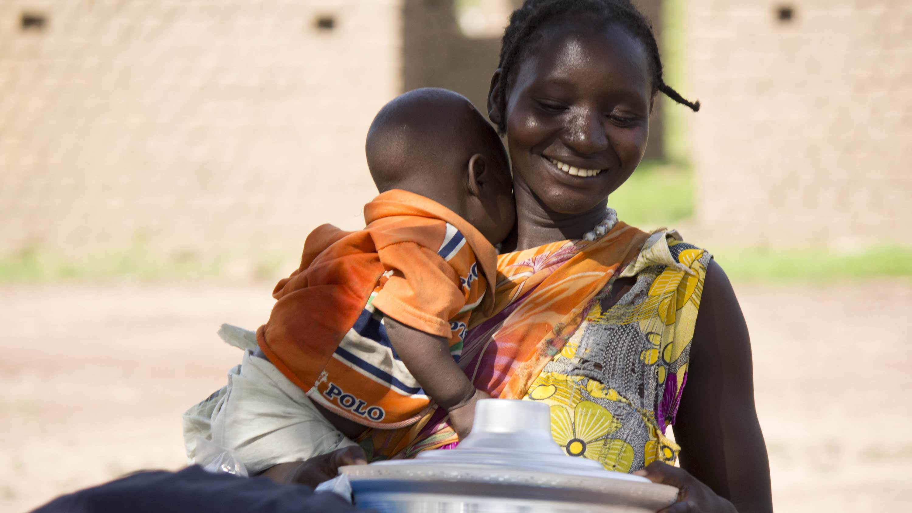 Smiling mother and her baby